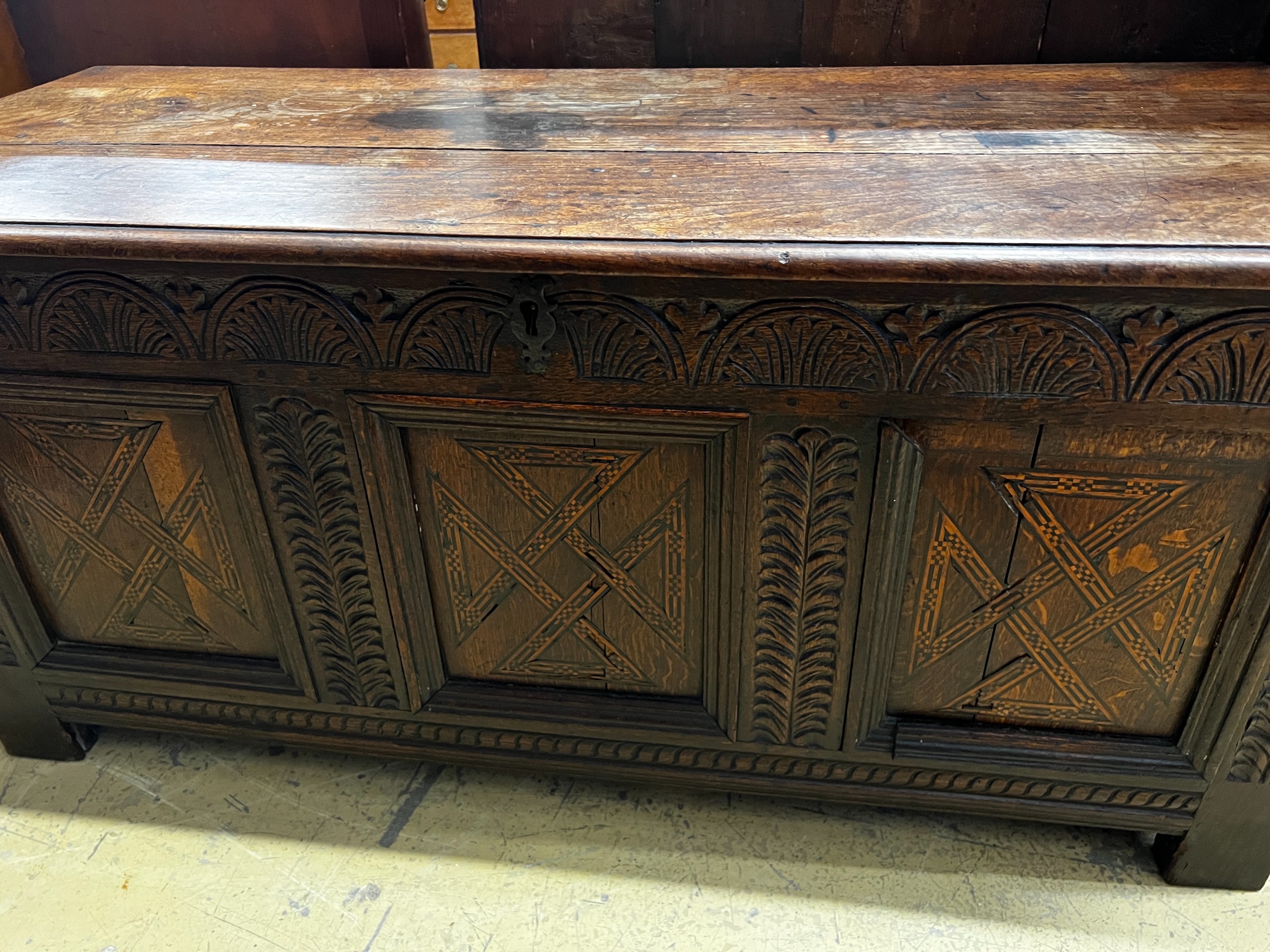 An 18th century inlaid oak coffer, length 133cm, depth 54cm, height 61cm